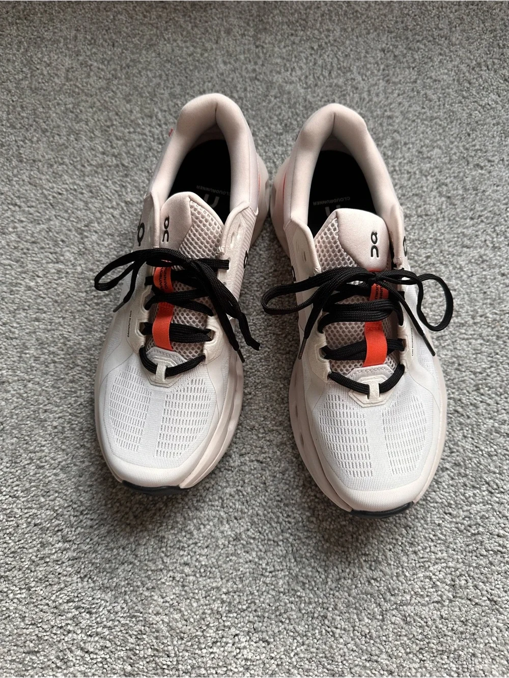 On Running Women’s Running Sneakers in Light Pink with Orange Accents